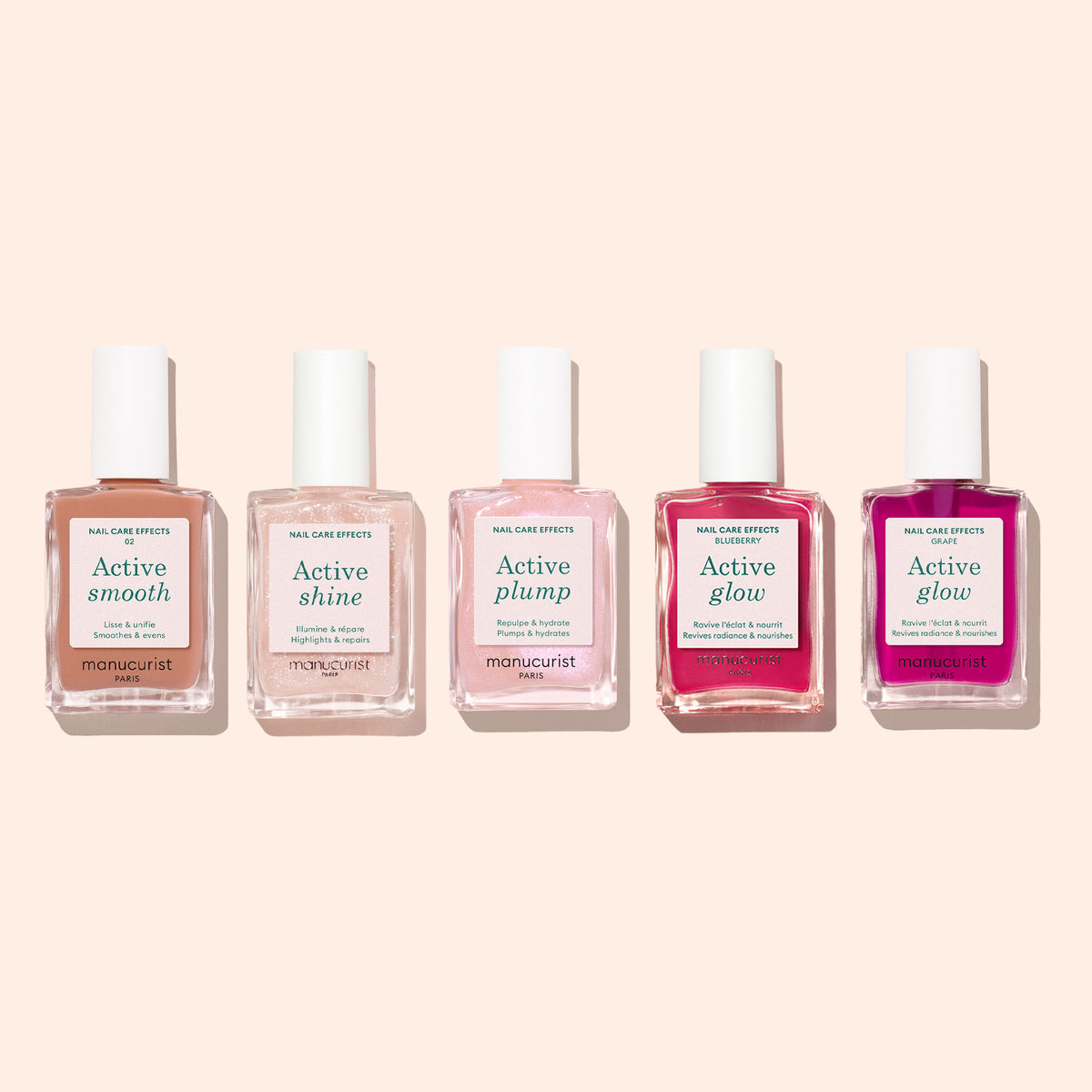 Five bottles of Manucurist nail care polish are arranged in a row against a light beige background. Each bottle, part of Manucurist’s innovative Active™ collection, is labeled with a different effect: Active™ Smooth 02, Active Shine, Active Plump, and two bottles of Active Glow. These CC Polish formulas by Manucurist offer targeted solutions for healthy-looking nails.