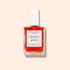 A bottle of Manucurist Active™ Glow Cranberry plant-based nail care polish with a white cap, displayed on a light beige background, provides beautifully tinted glow nails for a naturally radiant look.