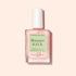 A bottle of Manucurist S.O.S. Nail Mask, a hydrating nail treatment with pink liquid and a white cap, sits against a light pink background. The label shows both French and English text.