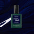 A bottle of Manucurist Dark Night gel polish is shown against a dark blue, shimmery abstract background with white streaks.