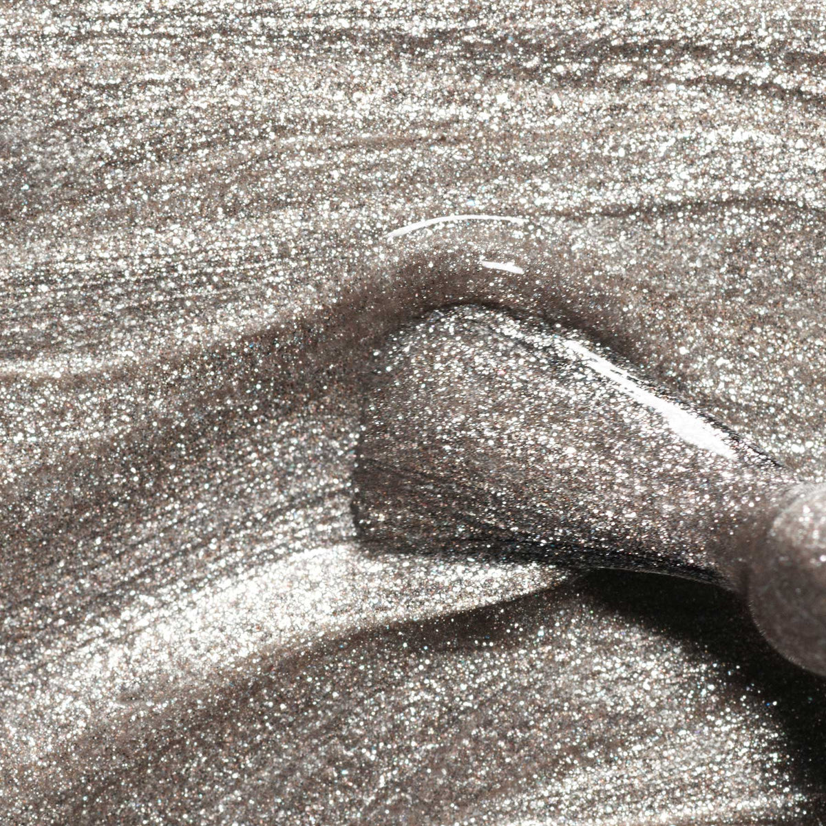 Close-up of a nail polish brush applying Manucurist&