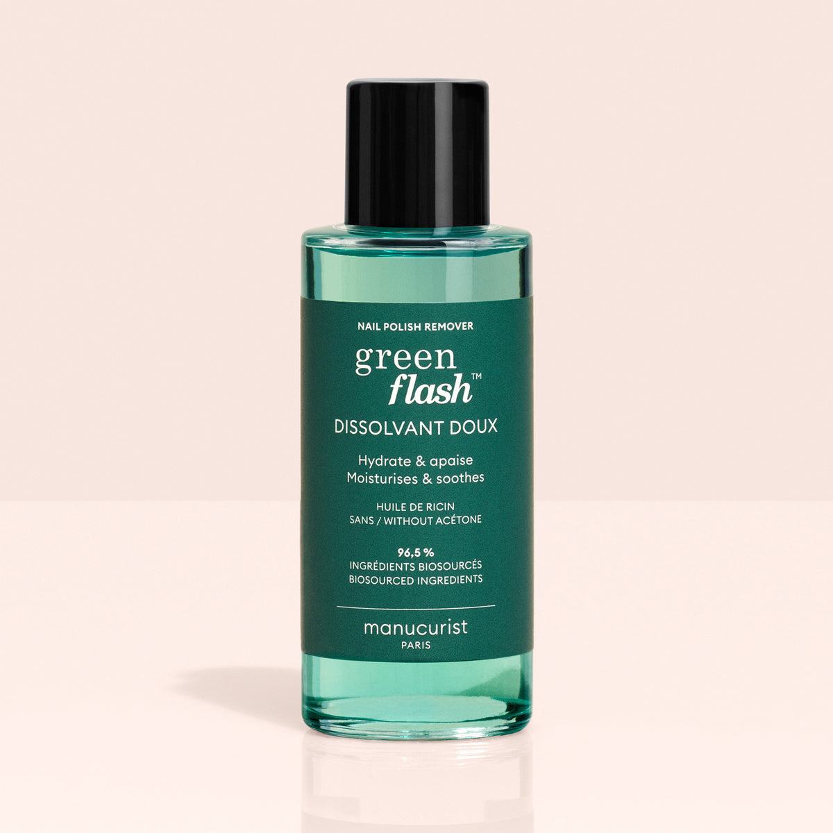 A green bottle of Green Flash™ Base Top Remover Trio by Manucurist, ideal for use with Green Flash gel polish. Acetone-free, moisturising, soothing, and made with 99.4% bio-sourced ingredients, set against a light background.