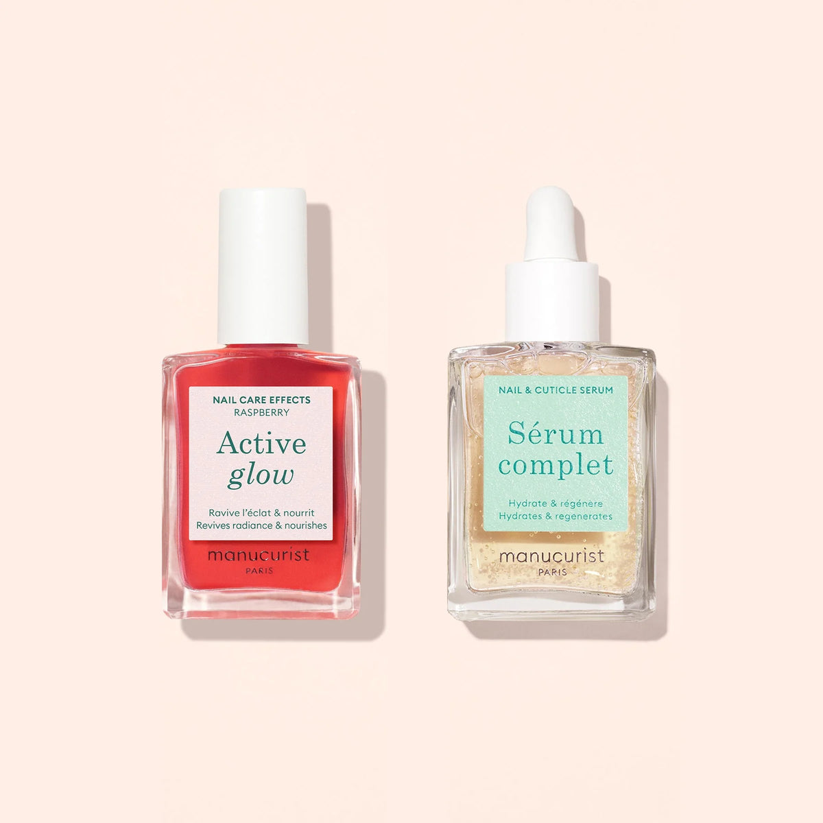 The Manucurist Healthy Glow Duo features two nail serums—Active Glow (pink) and Sérum Complet (clear)—displayed on a light beige background, designed to nourish and beautify nails.