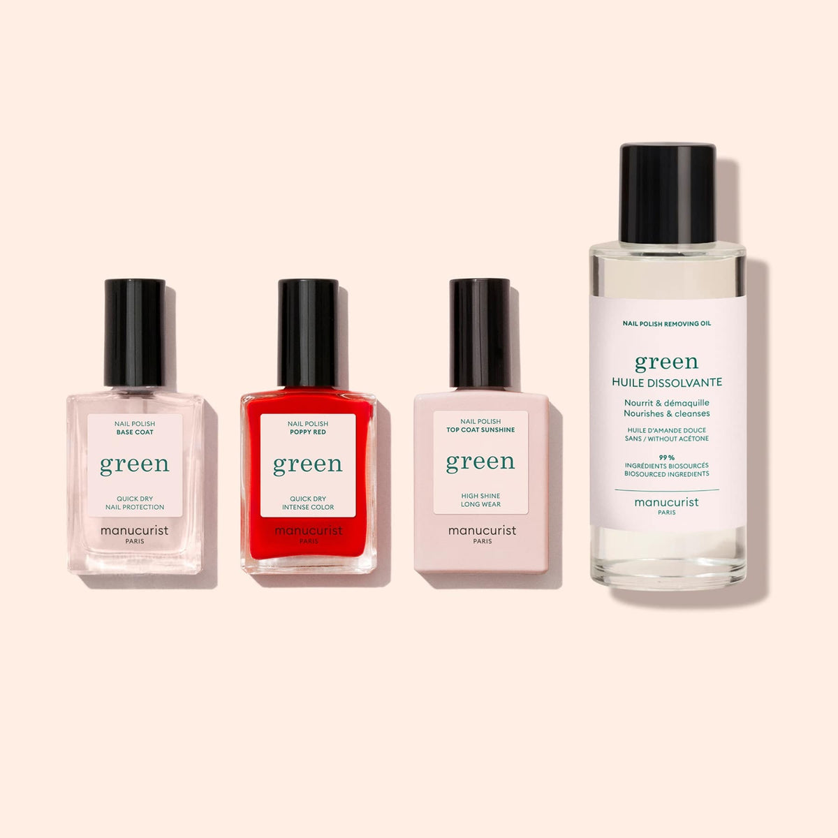 Le Basic Kit Manucurist comprend trois vernis effet gel (rose, rouge, transparent) dans des flacons rectangulaires et une huile dissolvante sans acétone plus grande, tous posés droits — le set idéal pour une manucure green parfaite.