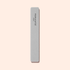 A rectangular gray Manucurist Nail buffer sponge with rounded edges is placed vertically on a light beige background, perfect for smoothing the nail plate and prepping your manicure.