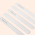 Five Manucurist Emery boards are arranged diagonally on a light beige background. Each file, featuring a fine grit surface, displays the brand name Manucurist printed in black letters.