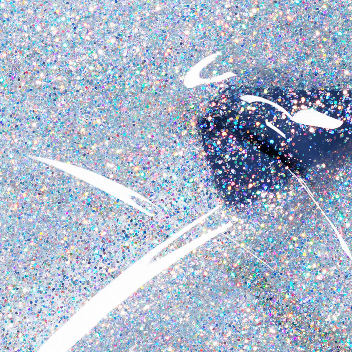 Close-up of glossy dark blue lips with white accents, coated in Manucurist&