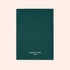 A green textured towel from Manucurist-us, featuring white "manucurist PARIS" text at the bottom center, displayed on a light beige background and ideal for surface protection.