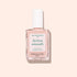 A bottle of Manucurist Active™ Smooth 00 nail treatment, topped with a white cap, sits on a light pink background. The white label features green and black text, highlighting the brand’s dedication to plant-based nails.