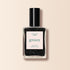 A clear glass bottle of Manucurist Sparks black nail polish with a shimmering finish and silver glitter. The label features "green" in large green text, plus "Nail Polish," "Sparks," and "Quick Dry Intense Color." Black cap included.