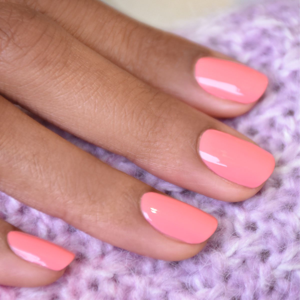 A close-up of a hand with neatly manicured nails painted in Manucurist&