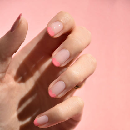 A hand with neatly manicured nails, styled with Manucurist&