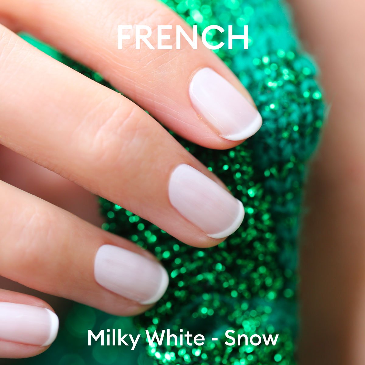 Close-up of a hand with French manicure in Manucurist Milky White gel polish, holding sparkly green textured fabric. Text on image: FRENCH at the top, Milky White - Manucurist at the bottom.