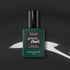 Manucurist’s Anthracite gel polish, a lustrous dark grey shade, is displayed on a black surface with white abstract highlights.