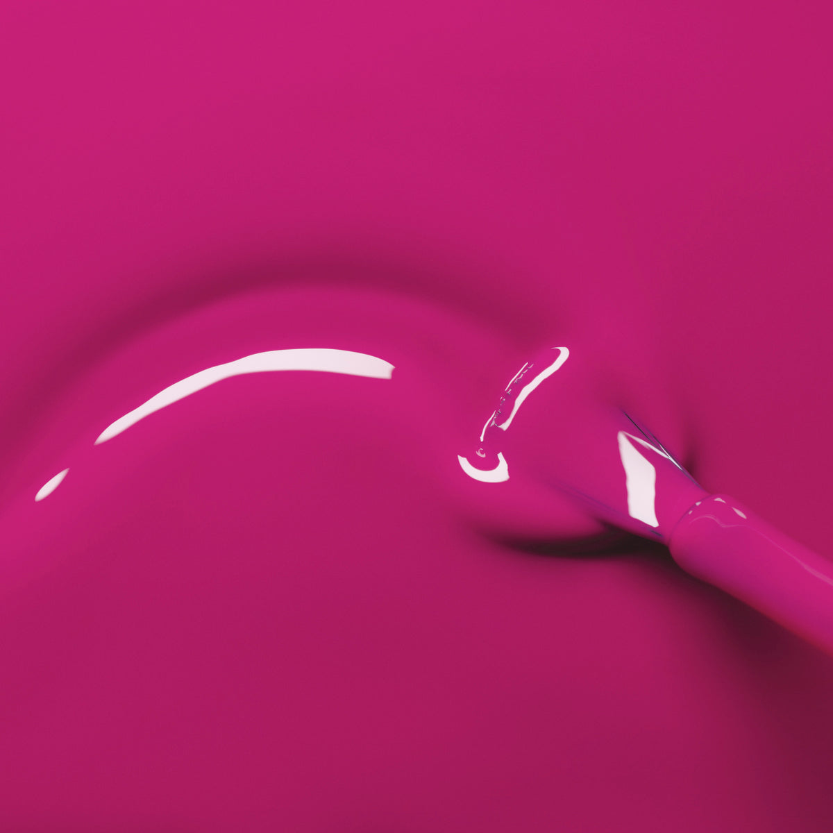 A close-up of a brush dipped in glossy, pinky mauve Armeria nail polish from Manucurist&