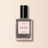 A bottle of Manucurist Clay nail polish in taupe gray, featuring a black cap and a beige label with "Nail Polish Clay, green, Quick Dry Intense Color, manucurist Paris.