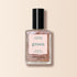 Un flacon de vernis à ongles Manucurist dans la teinte Cosmic Rose, avec une couleur rose scintillante et irisée, un bouchon noir et une étiquette rose indiquant "green" et Quick Dry Intense Color.