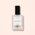 A frosted glass bottle of Manucurist Matte Top Coat with a black cap, ideal for a plant-based manicure, sits against a light beige background. The label features "Quick Dry Matte Effect.