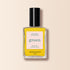 Un flacon de vernis à ongles jaune Gold Button de Manucurist avec un bouchon noir et une étiquette "couleur intense verte à séchage rapide", présenté sur un fond beige clair.