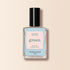 Un flacon de vernis à ongles Manucurist Light Blue de la gamme Green™, avec un bouchon noir et une étiquette « green quick dry intense color », est présenté sur un fond beige.