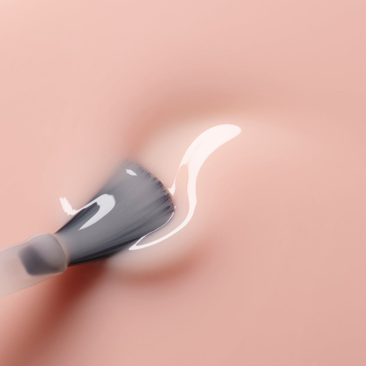 A close-up of a brush applying Manucurist&