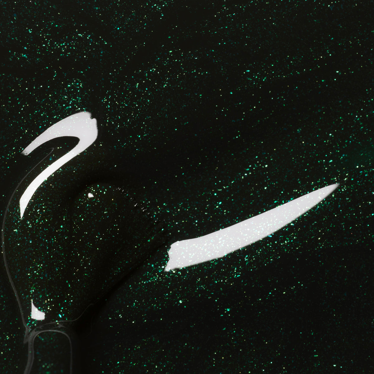 Close-up of Manucurist’s Poison, a forest green nail polish with fine glitter, featuring a glossy shimmer and visible brush strokes.