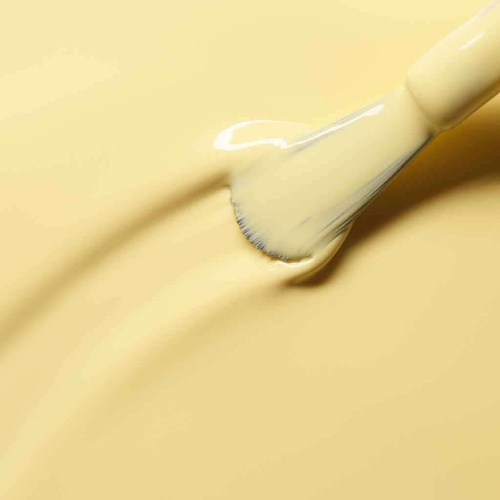 A close-up of a brush applying Manucurist&