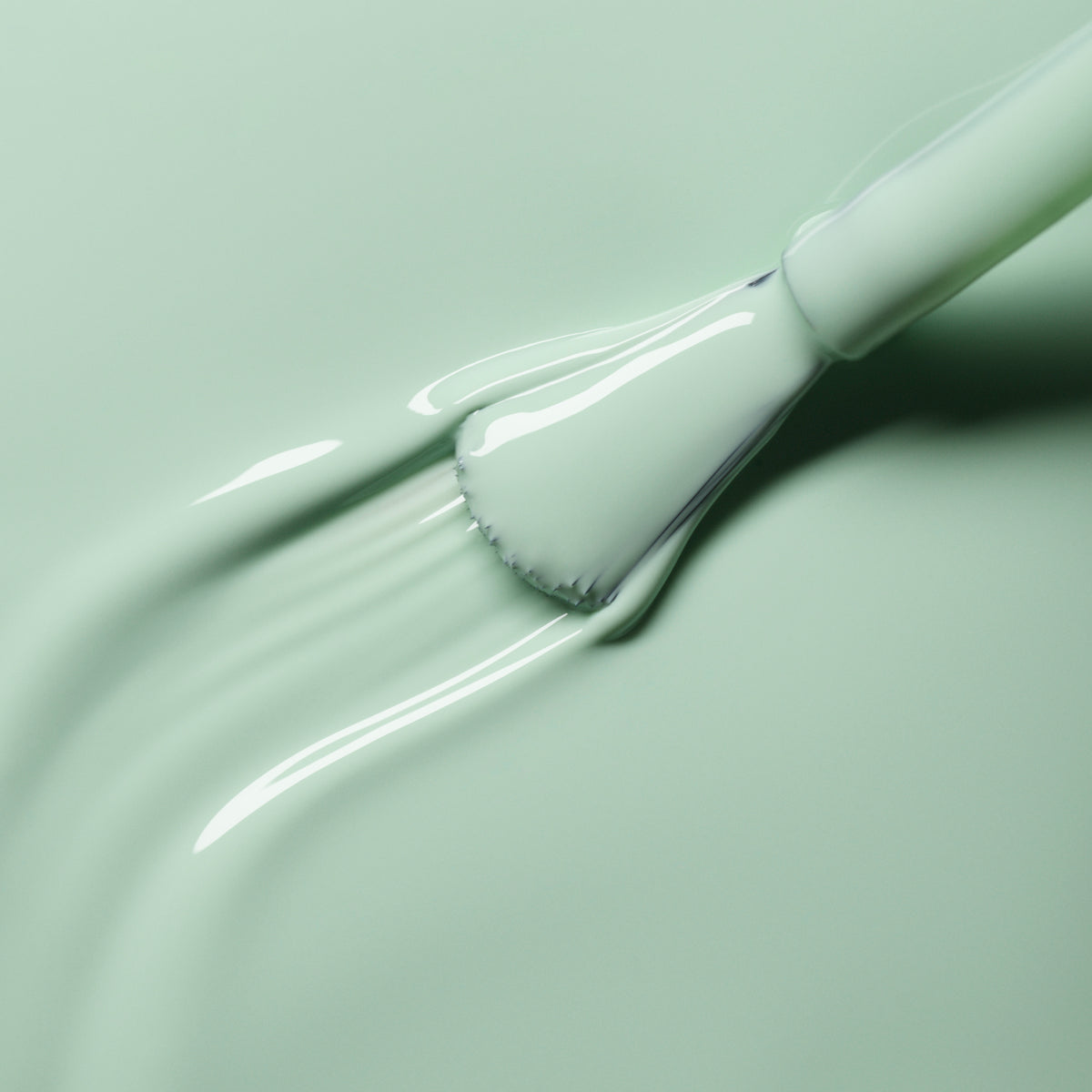 A close-up shows a brush spreading Manucurist&