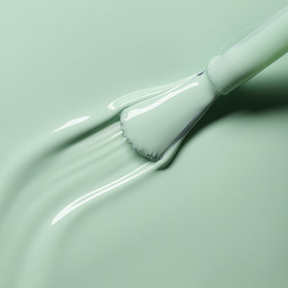 A close-up shows a brush spreading Manucurist&
