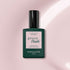 Manucurist Blossom: An opaque creamy gel polish in the shade Blossom, housed in a dark green rectangular bottle with a black cap and pale pink label, designed for chic nails.