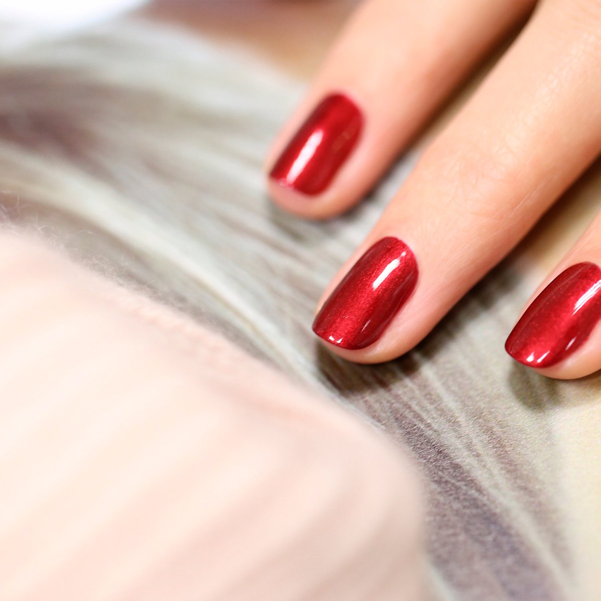 A close-up of a hand with neatly manicured nails painted in Manucurist&